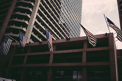 american flag USA flags hanging on brown wall symbol